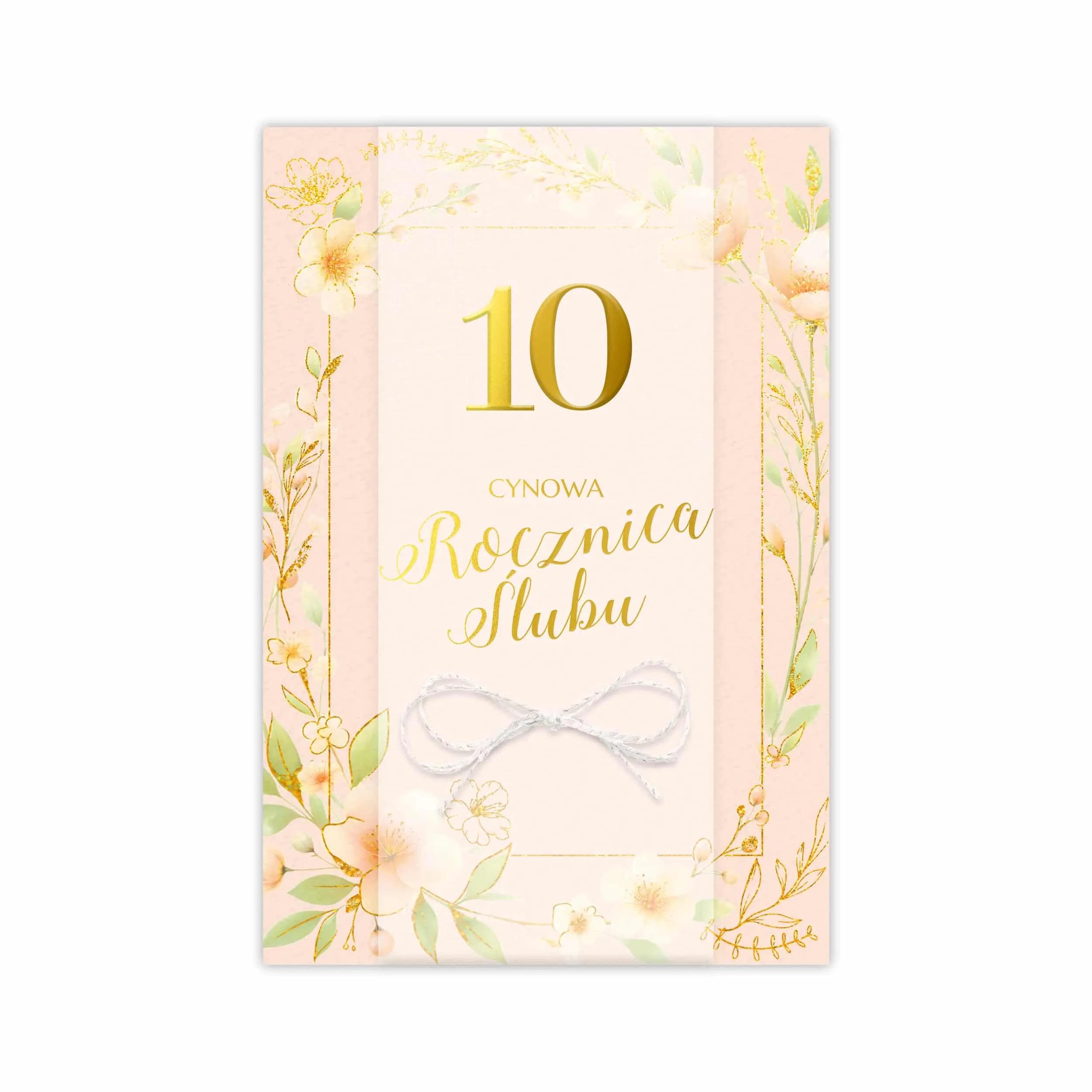 Elegancka kartka B6 LUX na 10 Rocznicę Ślubu z ozdobnym papierem, złoceniem, kalką i kokardką z białego sznurka ze złotymi akcentami. W środku gotowe życzenia i miejsce na dedykację.
