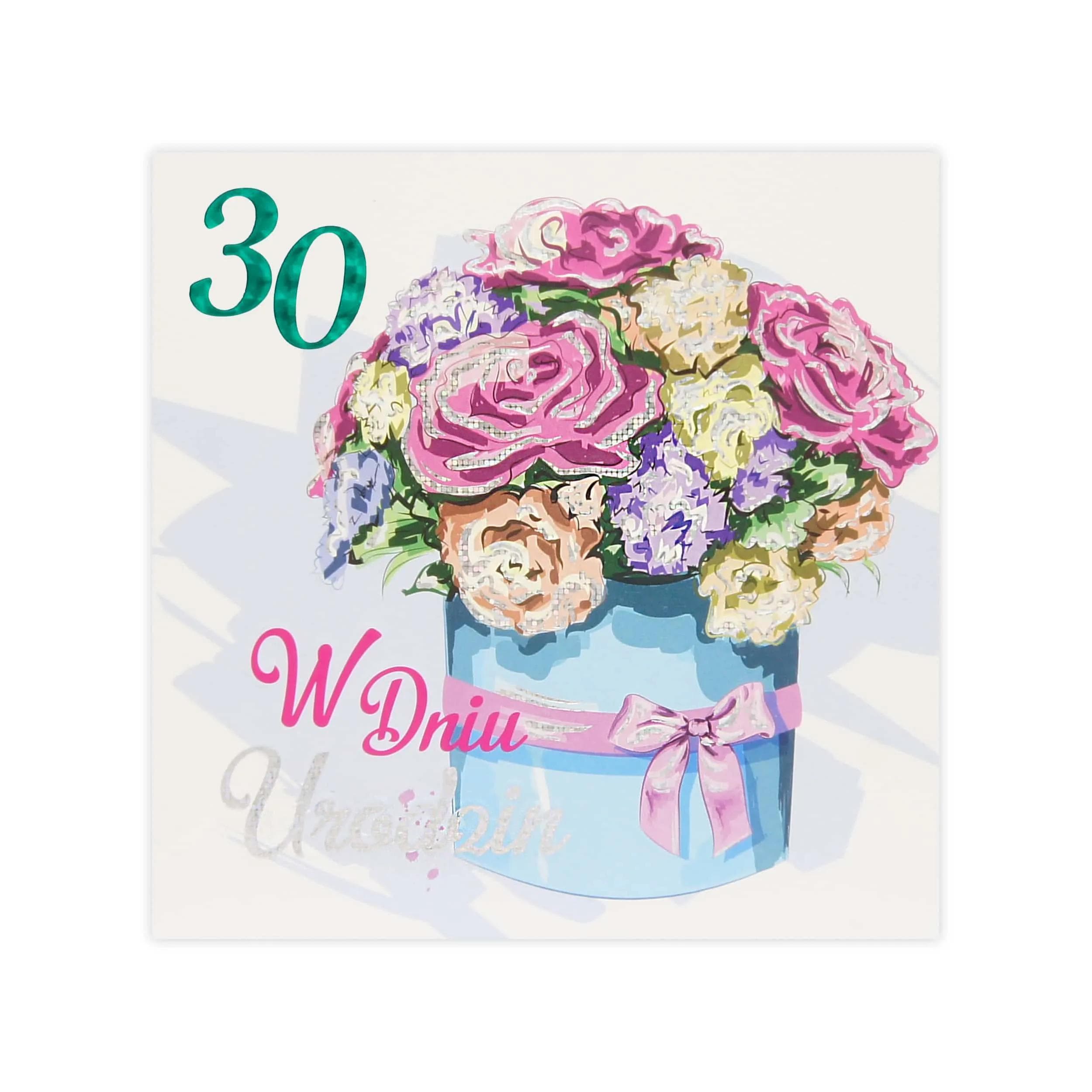 Kartka urodzinowa 30 z ilustracją niebieskiego pudełka z bukietem róż i goździków oraz napisem W dniu urodzin.