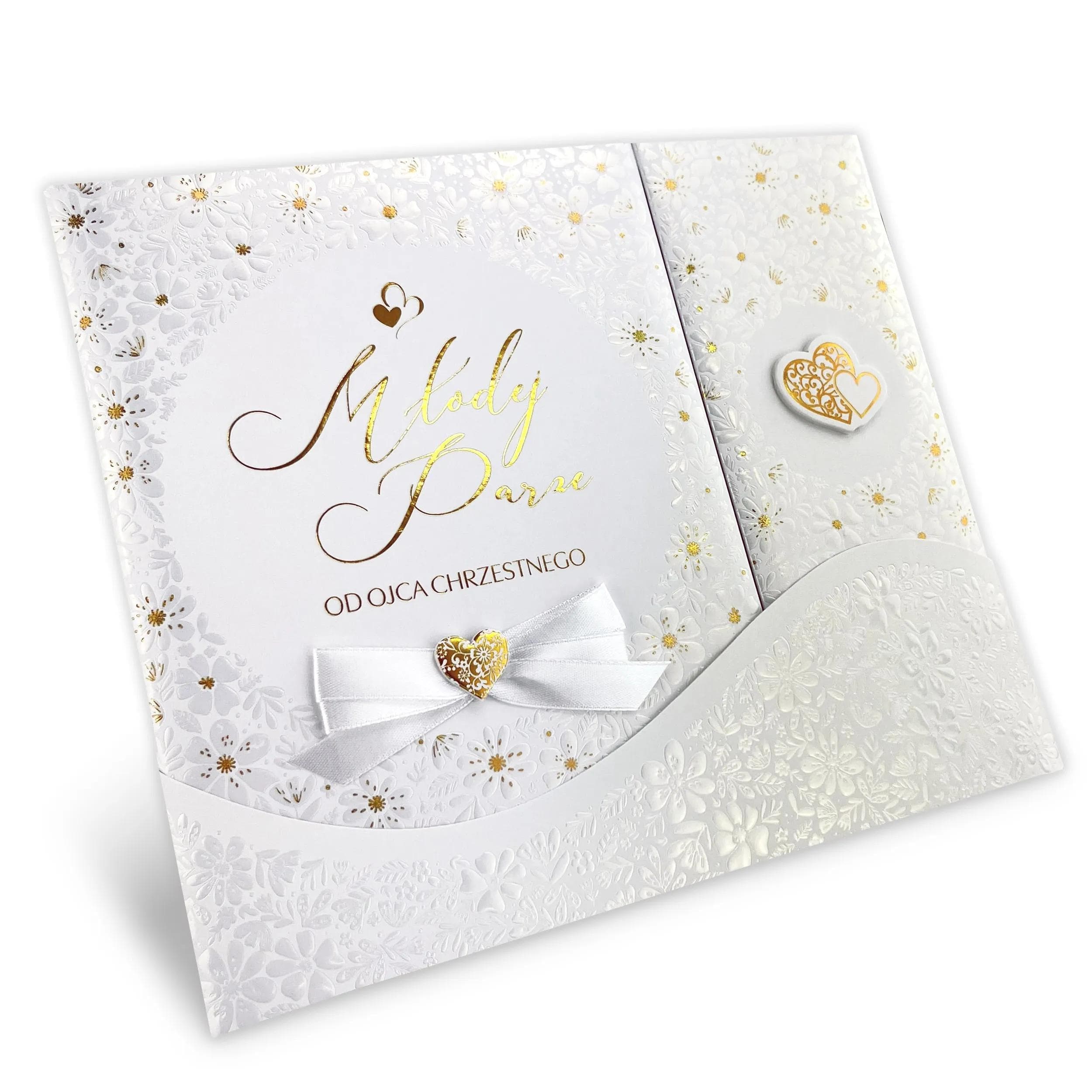 Album na zdjęcia Ślubne i wpisy gości - piękne złocenia, tłoczenia i satynowa kokarda sprawiają, że album jest niezwykle elegancki i stylowy, zdjęcie pod kątem - z dedykacją od Ojca Chrzestnego.